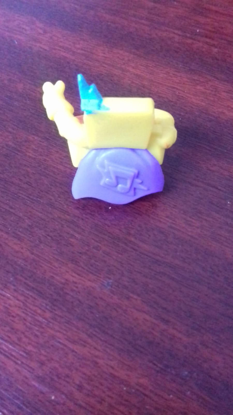 Super Zings yellow figure with blue mask and orange wheels - imagine 2